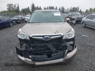 2015 Subaru Forester Touring with VIN JF2SJAUC1FH457069, listed as a IAAI auction lot 42293542 with 71,689 mi miles and . Bid and sale history available at DreamBid. Image 6.