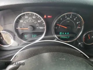 2015 Jeep Wrangler Unlimited Sahara z VIN 1C4BJWEG6FL627890, wystawiony jako Copart lot #58080945 z przebiegiem 145 941 mil mil oraz Szkoda całkowita • Salvage title. Historia ofert i sprzedaży dostępna na DreamBid. Obrazek 9.
