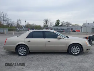 2009 Cadillac DTS w/1SA with VIN 1G6KD57Y29U137410, listed as a IAAI auction lot 42026044 with 112,916 mi miles. Bid and sale history available at carsss.com. Image 13.