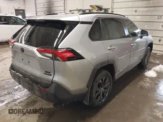 2024 Toyota RAV4 Hybrid XLE Premium with VIN JTMB6RFV5RD148973, listed as a IAAI auction lot 41516422 with 8,797 mi miles. Bid and sale history available at carsss.com. Image 4.