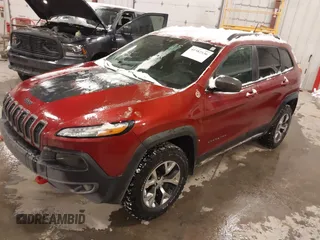 2015 Jeep Cherokee Trailhawk with VIN 1C4PJMBS2FW609999, listed as a IAAI auction lot 41582536 with 133,666 mi miles. Bid and sale history available at carsss.com. Image 17.