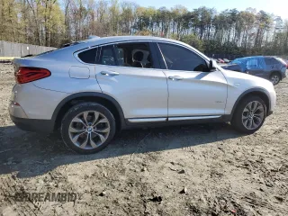 2017 BMW X4 xDrive28i with VIN 5UXXW3C52H0T77719, listed as a Copart auction lot 52393155 with 184,664 mi miles and Salvage title. Bid and sale history available at DreamBid. Image 3.