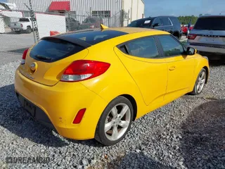 2012 Hyundai Veloster w/Gray Int with VIN KMHTC6AD2CU079902, listed as a IAAI auction lot 42088473 with 143,983 mi miles. Bid and sale history available at carsss.com. Image 4.