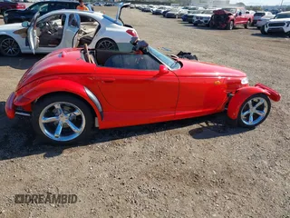 1999 Plymouth Prowler z VIN 1P3EW65G4XV503282, wystawiony jako IAAI lot #41282258 z przebiegiem 58 866 mil mil oraz . Historia ofert i sprzedaży dostępna na DreamBid. Obrazek 13.