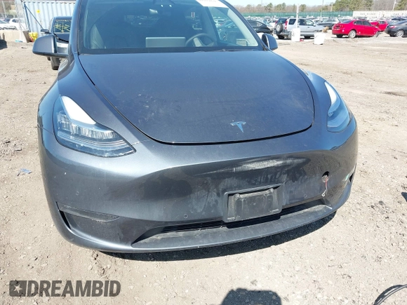 2022 Tesla Model Y Long Range with VIN 7SAYGDEE2NF460945, listed as a IAAI auction lot 41921645 with 62,318 mi miles and . Bid and sale history available at DreamBid. Image 6.