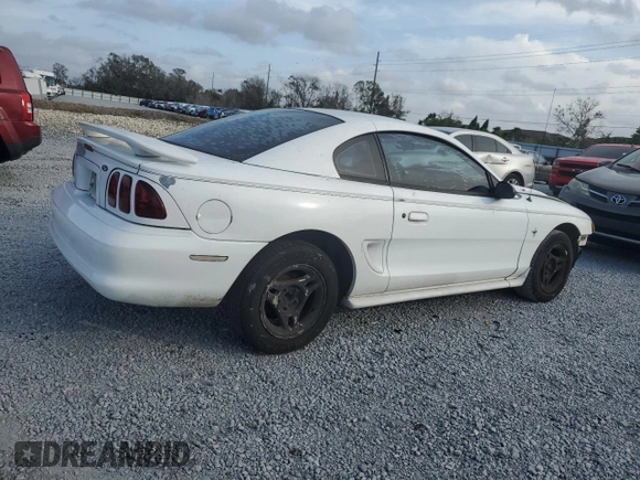 1997 Ford Mustang with VIN 1FALP4044VF174876, listed as a Copart auction lot 41601355 with 103,828 mi miles and Salvage Title. Bid and sale history available at carsss.com. Image 3.