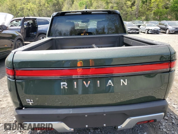 2024 Rivian R1T Adventure z VIN 7FCTGCAA1RN030829, wystawiony jako Copart lot #55557565 z przebiegiem Nie podano mil oraz Szkody całkowita. Historia ofert i sprzedaży dostępna na DreamBid. Obrazek 6.