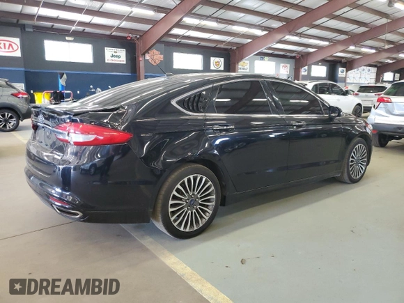 2017 Ford Fusion Titanium z VIN 3FA6P0K96HR124759, wystawiony jako Copart lot #61414395 z przebiegiem 175 655 mil mil oraz Czysty tytuł • Clean title. Historia ofert i sprzedaży dostępna na DreamBid. Obrazek 3.