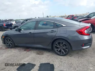 2019 Honda Civic Sport with VIN 2HGFC2F89KH563333, listed as a IAAI auction lot 41959217 with 66,068 mi miles and . Bid and sale history available at DreamBid. Image 14.