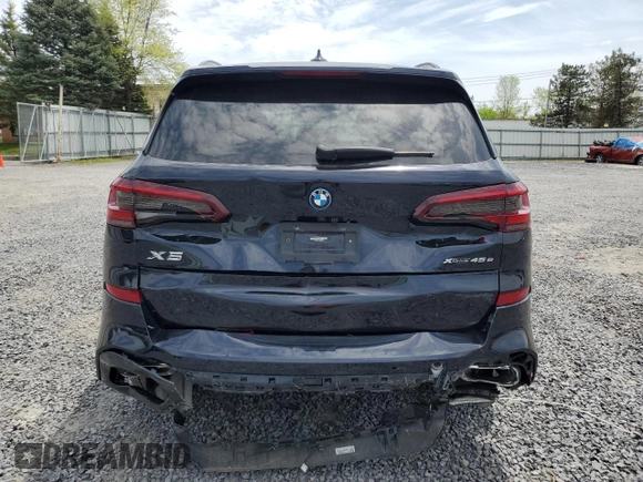 2023 BMW X5 xDrive45e z VIN 5UXTA6C01P9R61137, wystawiony jako Copart lot #56458155 z przebiegiem 27 501 mil mil oraz Szkoda całkowita • Salvage title. Historia ofert i sprzedaży dostępna na DreamBid. Obrazek 6.