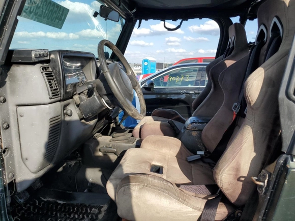 1997 Jeep Wrangler Sport with VIN 1J4FY19S0VP453959, listed as a Copart auction lot 44560295 with 182,464 mi miles and Salvage Title. Bid and sale history available at carsss.com. Image 7.