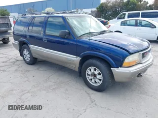 1999 GMC Jimmy SLE with VIN 1GKDT13W8X2526345, listed as a IAAI auction lot 41919975 with 164,214 mi miles. Bid and sale history available at carsss.com. Image 1.