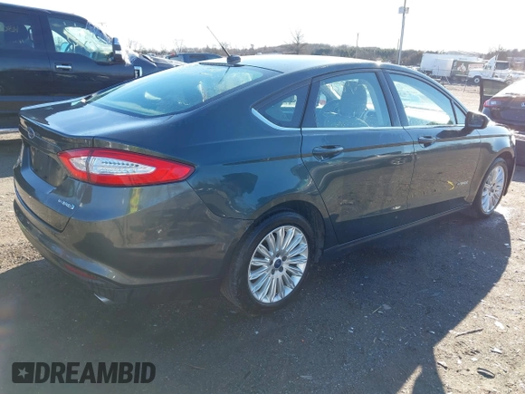 2015 Ford Fusion S Hybrid with VIN 3FA6P0UU7FR117785, listed as a IAAI auction lot 41589546 with 136,657 mi miles. Bid and sale history available at carsss.com. Image 4.