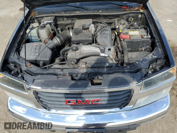 2011 GMC Canyon SLE1 with VIN 1GTH6MFE8B8102114, listed as a Copart auction lot 74137234 with 150,598 mi miles and Salvage title. Bid and sale history available at DreamBid. Image 11.