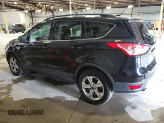 2016 Ford Escape SE with VIN 1FMCU9GX1GUC24692, listed as a Copart auction lot 88102815 with 114,900 mi miles and Salvage Title. Bid and sale history available at DreamBid. Image 2.