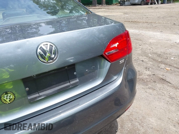 2014 Volkswagen Jetta SE with VIN 3VWD07AJ0EM236487, listed as a IAAI auction lot 42714441 with 124,596 mi miles and . Bid and sale history available at DreamBid. Image 12.