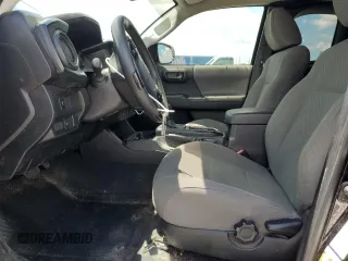 2022 Toyota Tacoma SR with VIN 3TYRX5GNXNT047479, listed as a Copart auction lot 57023765 with 84,802 mi miles and Salvage title. Bid and sale history available at DreamBid. Image 7.