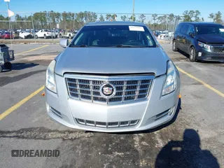 2013 Cadillac XTS Premium z VIN 2G61S5S35D9209252, wystawiony jako IAAI lot #41275066 z przebiegiem 132 311 mil mil oraz . Historia ofert i sprzedaży dostępna na DreamBid. Obrazek 13.