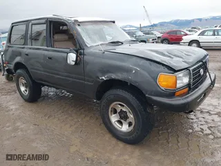 1996 Toyota Land Cruiser with VIN JT3HJ85J4T0115628, listed as a IAAI auction lot 41191476 with 210,005 mi miles. Bid and sale history available at carsss.com. Image 1.