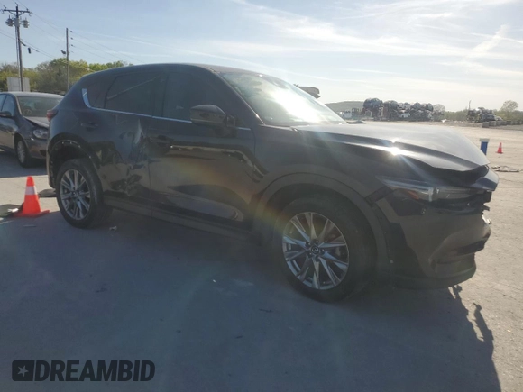 2021 Mazda CX-5 Grand Touring with VIN JM3KFADM2M0390669, listed as a Copart auction lot 53540805 with 150,092 mi miles and Clean Title. Bid and sale history available at carsss.com. Image 4.