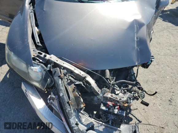 2009 Honda Civic LX z VIN 19XFA16559E020457, wystawiony jako Copart lot #58721185 z przebiegiem Nie podano mil oraz Szkoda całkowita • Salvage title. Historia ofert i sprzedaży dostępna na DreamBid. Obrazek 11.