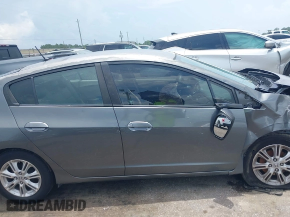 2010 Honda Insight EX z VIN JHMZE2H72AS023404, wystawiony jako IAAI lot #42505042 z przebiegiem Nie podano mil oraz . Historia ofert i sprzedaży dostępna na DreamBid. Obrazek 12.