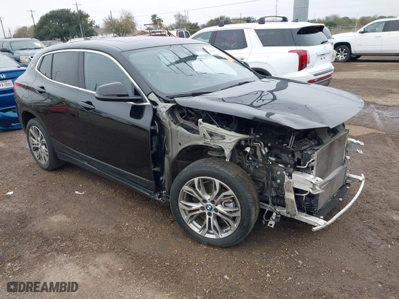 2022 BMW X2 xDrive28i with VIN WBXYJ1C01N5U20171, listed as a IAAI auction lot 41284932 with 64,256 mi miles. Bid and sale history available at carsss.com. Image 1.