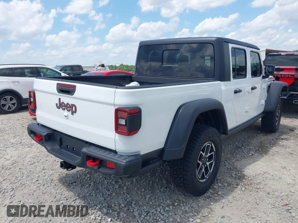 2024 Jeep Gladiator Rubicon z VIN 1C6JJTBG5RL110865, wystawiony jako IAAI lot #42104829 z przebiegiem 6 815 mil mil oraz . Historia ofert i sprzedaży dostępna na DreamBid. Obrazek 4.