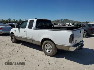 2002 Ford F-150 XL with VIN 1FTRX17W82NA64876, listed as a Copart auction lot 50013045 with 256,345 mi miles and Salvage Title. Bid and sale history available at carsss.com. Image 2.