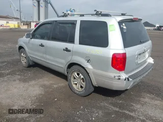 2005 Honda Pilot EX with VIN 2HKYF184X5H533837, listed as a IAAI auction lot 41900265 with 163,522 mi miles. Bid and sale history available at carsss.com. Image 3.
