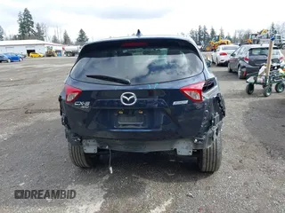 2015 Mazda CX-5 Touring with VIN JM3KE4CY5F0453646, listed as a IAAI auction lot 41740574 with 91,167 mi miles. Bid and sale history available at carsss.com. Image 17.