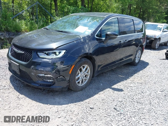 2023 Chrysler Pacifica Touring L with VIN 2C4RC1BG2PR534194, listed as a IAAI auction lot 42613934 with 69,896 mi miles and . Bid and sale history available at DreamBid. Image 2.