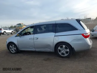 2012 Honda Odyssey Touring with VIN 5FNRL5H96CB095264, listed as a IAAI auction lot 41403450 with 246,199 mi miles. Bid and sale history available at carsss.com. Image 14.