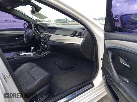 2013 BMW M5 with VIN WBSFV9C56DC772961, listed as a IAAI auction lot 41765457 with 104,568 mi miles. Bid and sale history available at carsss.com. Image 5.