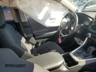 2023 Toyota RAV4 Hybrid LE with VIN JTMLWRFV0PD207803, listed as a Copart auction lot 55694695 with 13,198 mi miles and Salvage title. Bid and sale history available at DreamBid. Image 7.