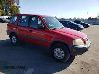 2000 Honda CR-V LX with VIN JHLRD1843YC063597, listed as a Copart auction lot 77765884 with 310,685 mi miles and Salvage Title. Bid and sale history available at carsss.com. Image 4.
