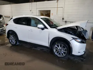 2020 Mazda CX-5 Grand Touring with VIN JM3KFBDM5L1851734, listed as a Copart auction lot 56729585 with 39,023 mi miles and Salvage title. Bid and sale history available at DreamBid. Image 4.