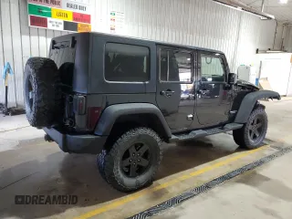 2009 Jeep Wrangler Unlimited Rubicon with VIN 1J8GA69179L756441, listed as a Copart auction lot 52111435 with 157,818 mi miles and Salvage title. Bid and sale history available at DreamBid. Image 3.