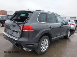 2012 Volkswagen Touareg Sport with VIN WVGEF9BP9CD008545, listed as a IAAI auction lot 41492653 with 138,424 mi miles and . Bid and sale history available at DreamBid. Image 4.