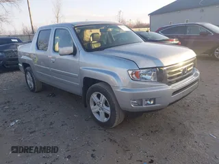 2014 Honda Ridgeline RTL with VIN 5FPYK1F57EB009199, listed as a IAAI auction lot 41208488 with 100,340 mi miles. Bid and sale history available at carsss.com. Image 1.