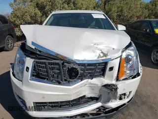 2013 Cadillac SRX Performance Collection with VIN 3GYFNDE37DS599557, listed as a IAAI auction lot 41633569 with 100,611 mi miles and . Bid and sale history available at DreamBid. Image 12.