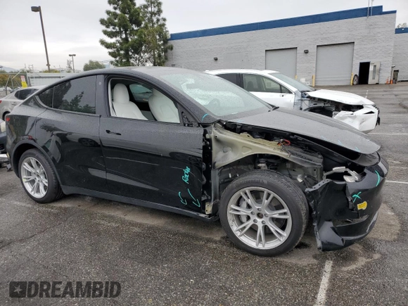 2021 Tesla Model Y Long Range with VIN 5YJYGDEEXMF294556, listed as a Copart auction lot 46668035 with 42,772 mi miles and Salvage Title. Bid and sale history available at DreamBid. Image 4.