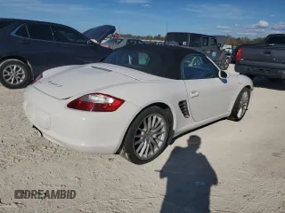 2007 Porsche Boxster S z VIN WP0CB29837U730970, wystawiony jako Copart lot #77829184 z przebiegiem Nie podano mil oraz Szkoda całkowita • Salvage title. Historia ofert i sprzedaży dostępna na DreamBid. Obrazek 3.