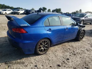 2015 Mitsubishi Lancer Evolution Final Edition z VIN JA32W7FV7FU608214, wystawiony jako Copart lot #68316174 z przebiegiem 56 714 mil mil oraz Szkody całkowita. Historia ofert i sprzedaży dostępna na DreamBid. Obrazek 3.