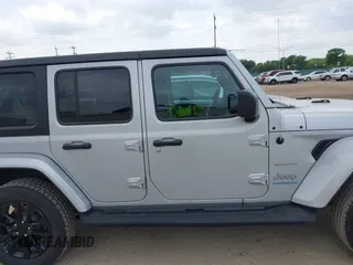 2023 Jeep Wrangler Sahara with VIN 1C4JJXP62PW627455, listed as a IAAI auction lot 42115137 with 62,143 mi miles and . Bid and sale history available at carsss.com. Image 13.