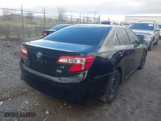2012 Toyota Camry Hybrid XLE with VIN 4T1BD1FK4CU027058, listed as a IAAI auction lot 41979201 with 281,983 mi miles. Bid and sale history available at carsss.com. Image 4.