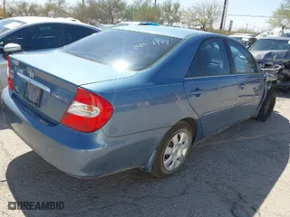 2004 Toyota Camry LE with VIN 4T1BE32K04U907223, listed as a IAAI auction lot 41795149 with 82,411 mi miles. Bid and sale history available at carsss.com. Image 4.