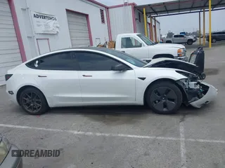 2023 Tesla Model 3 with VIN 5YJ3E1EA2PF417959, listed as a IAAI auction lot 42463853 with 22,736 mi miles and . Bid and sale history available at DreamBid. Image 14.