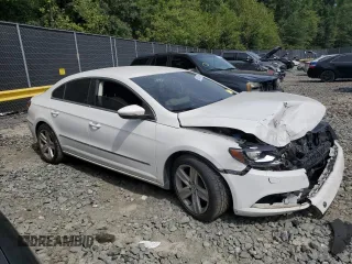 2014 Volkswagen CC Sport with VIN WVWBN7AN3EE528302, listed as a Copart auction lot 69636034 with 77,332 mi miles and Salvage Title. Bid and sale history available at DreamBid. Image 4.