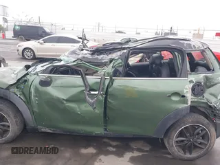 2015 MINI Countryman z VIN WMWZB3C59FWR43209, wystawiony jako IAAI lot #41761218 z przebiegiem Nie podano mil oraz . Historia ofert i sprzedaży dostępna na DreamBid. Obrazek 14.